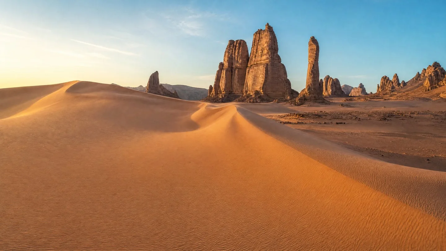Cover image for A sacred desert landscape where ancient history meets the shifting sands of time