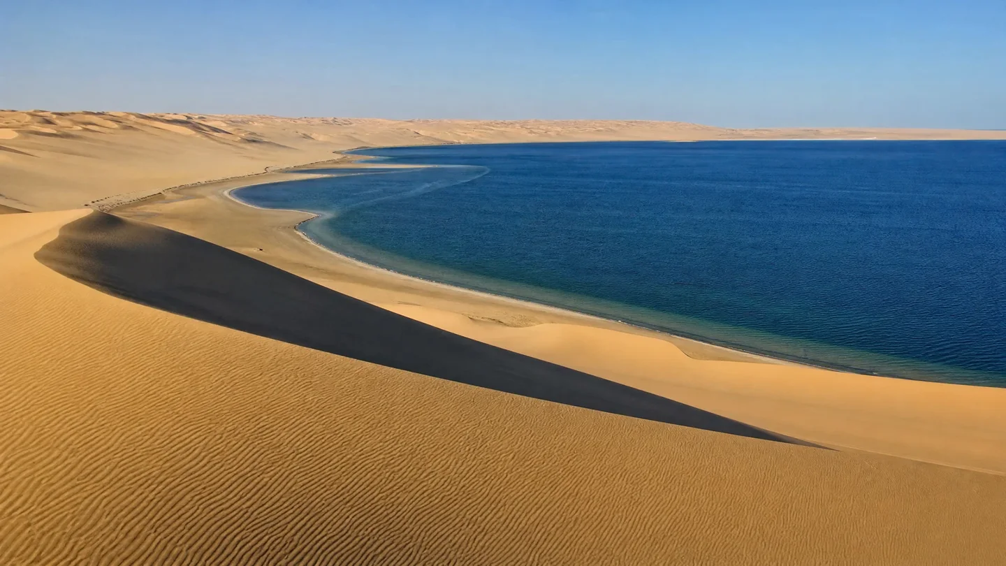 Cover image for Where the Great Dunes Meet the Sea: A Journey into Qatar's Khor Al Adaid.