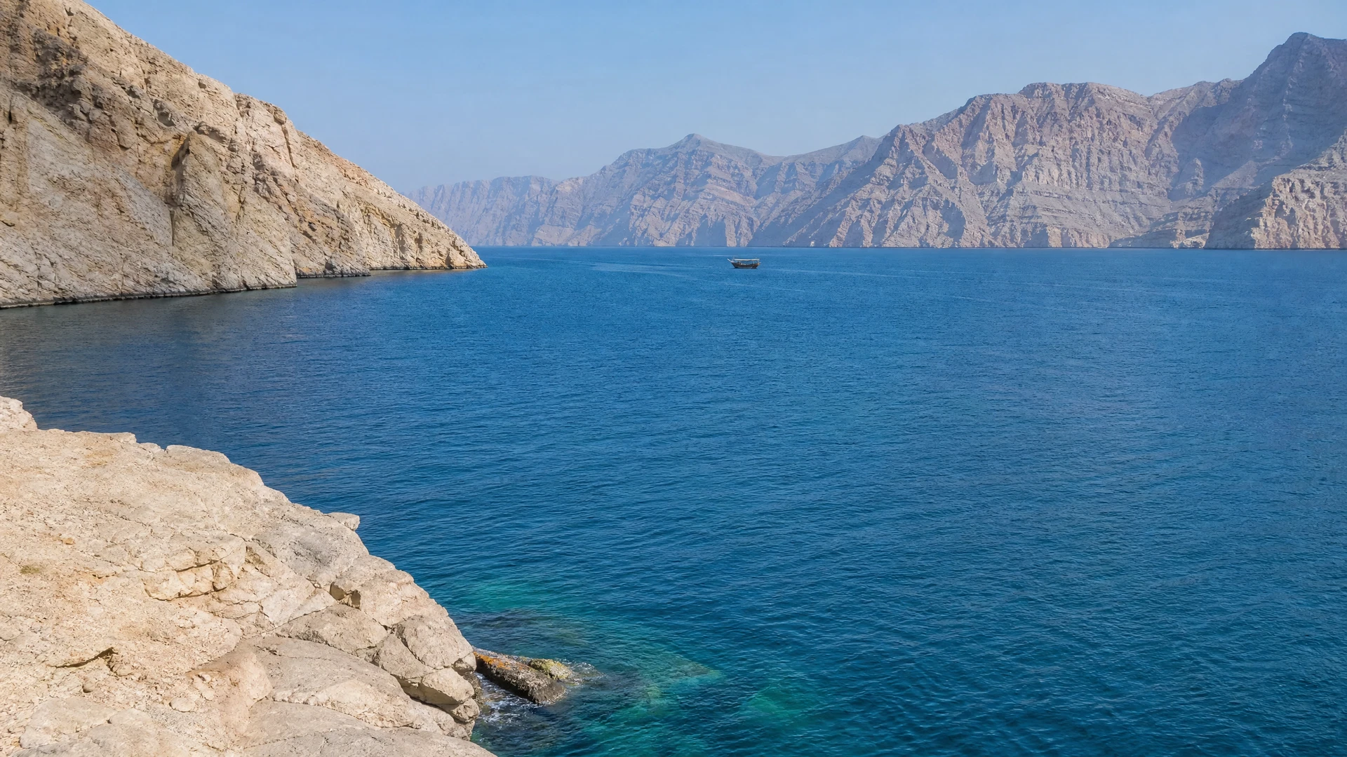 Cover image for The limestone cathedrals of Musandam rise where the desert meets the deep Arabian sea.