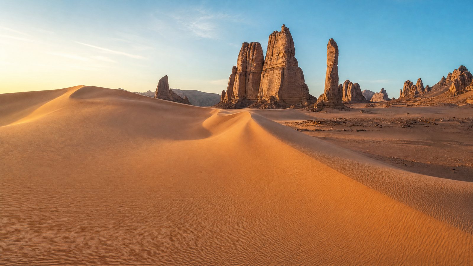 Cover image for A sacred desert landscape where ancient history meets the shifting sands of time